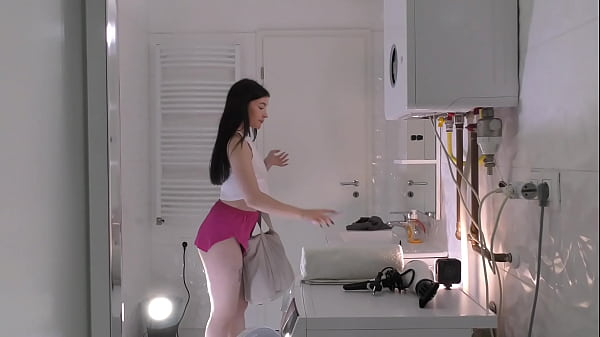 Amazingly beautiful college girl prepares for a night out with a short cut mini skirt to flash her white panties